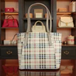 Classic checkered tote handbag in beige displayed in boutique setting