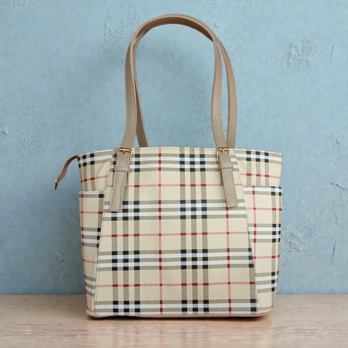 Classic Checkered Tote Handbag – Beige front Classic beige checkered tote handbag with long dual straps against blue background