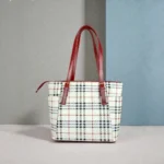 Front view of classic checkered white tote handbag with red straps