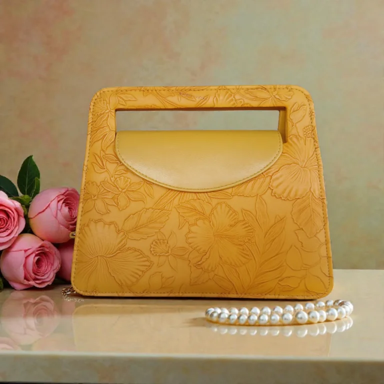Embossed floral mini carry crossbody bag in mustard yellow front view with roses decoration