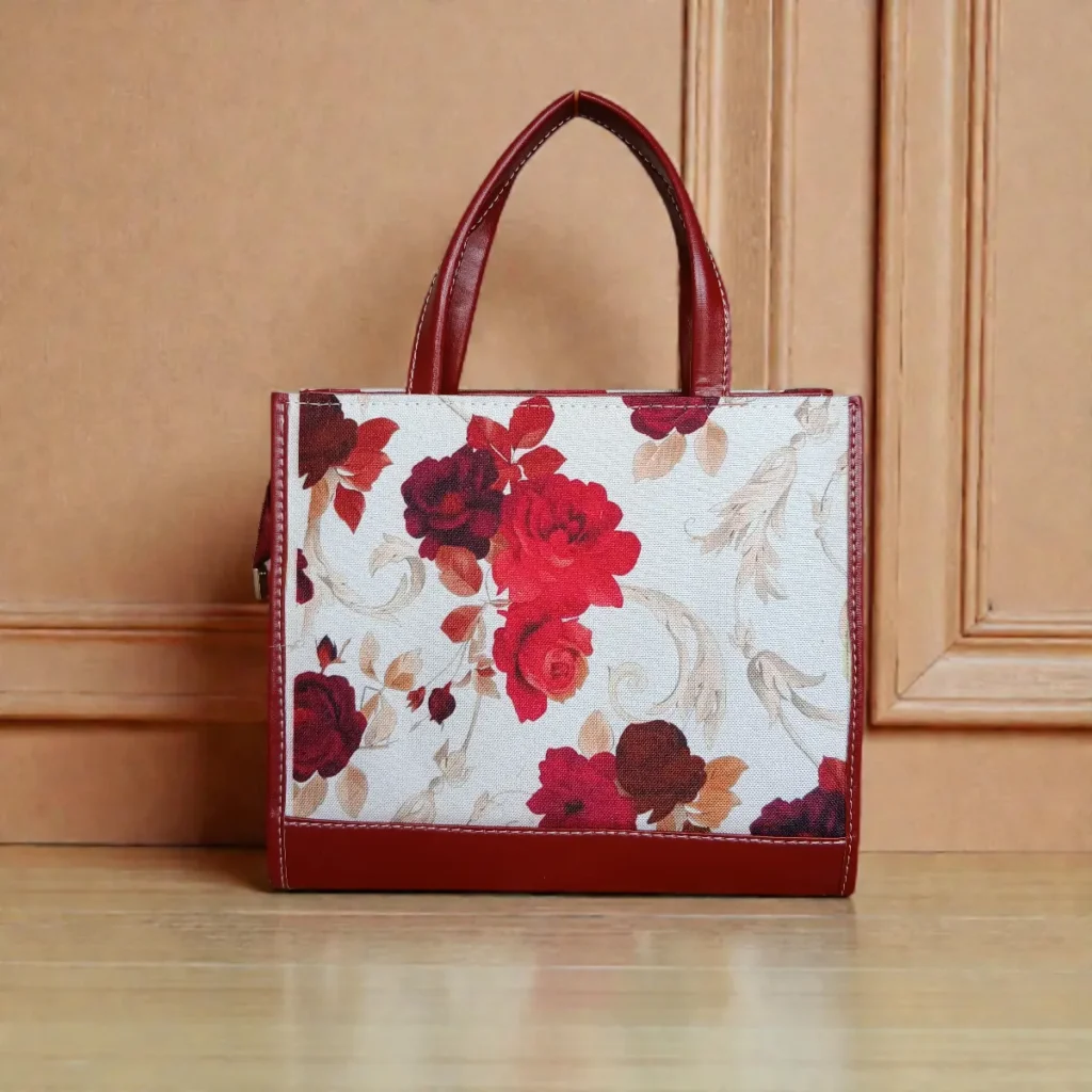 Back view of maroon crossbody handbag with clean leather finish and handles