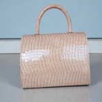 Glossy beige croc handbag back view