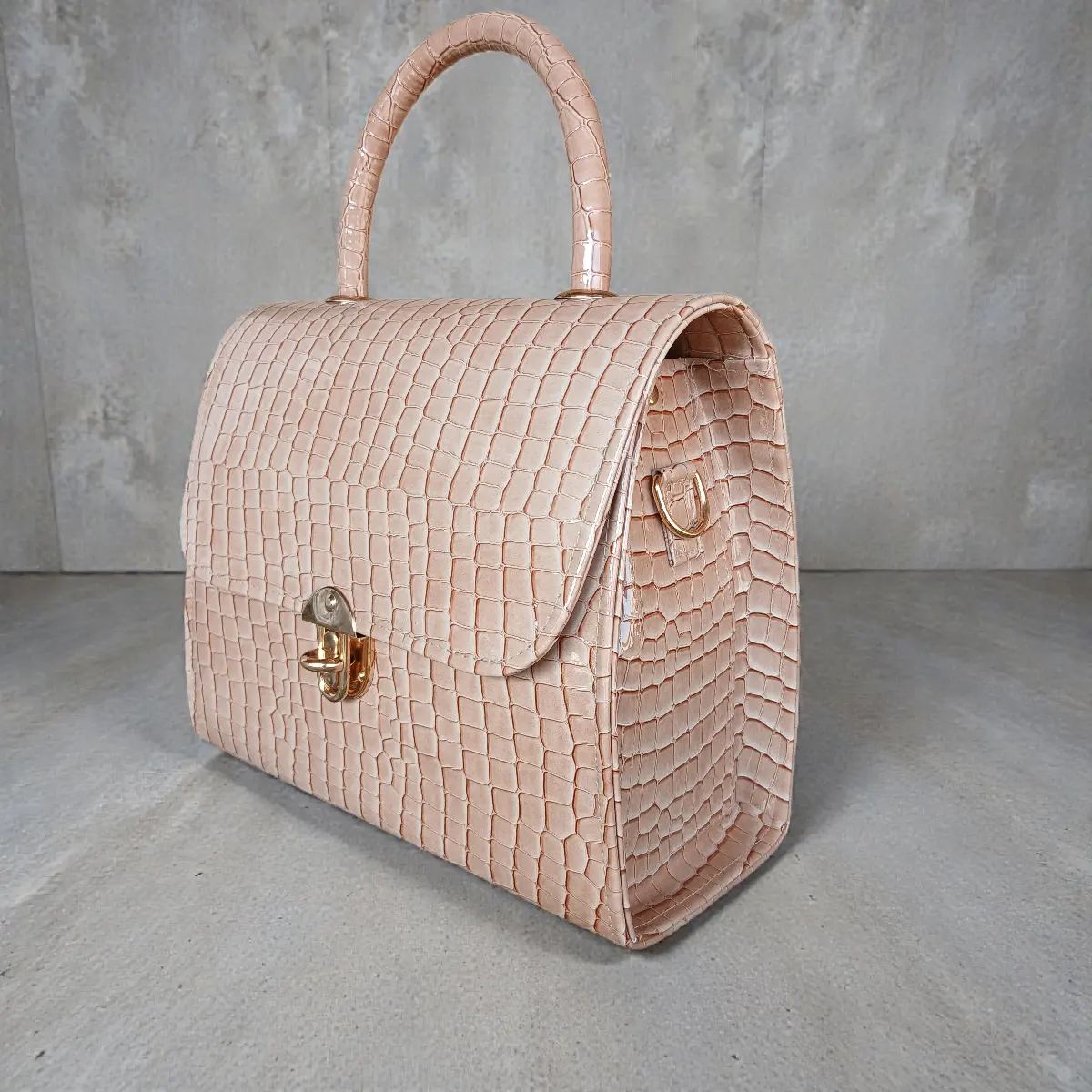 Glossy beige croc handbag side view
