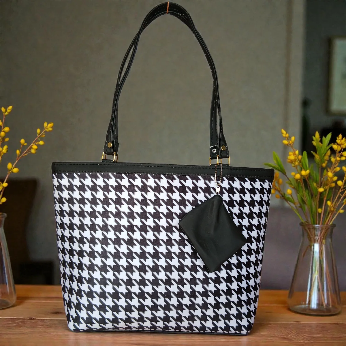 Black and white printed ladies tote bag with houndstooth pattern, long shoulder straps and detachable zip pouch
