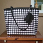Printed black and white ladies tote bag with houndstooth pattern, dual shoulder straps and detachable zip pouch