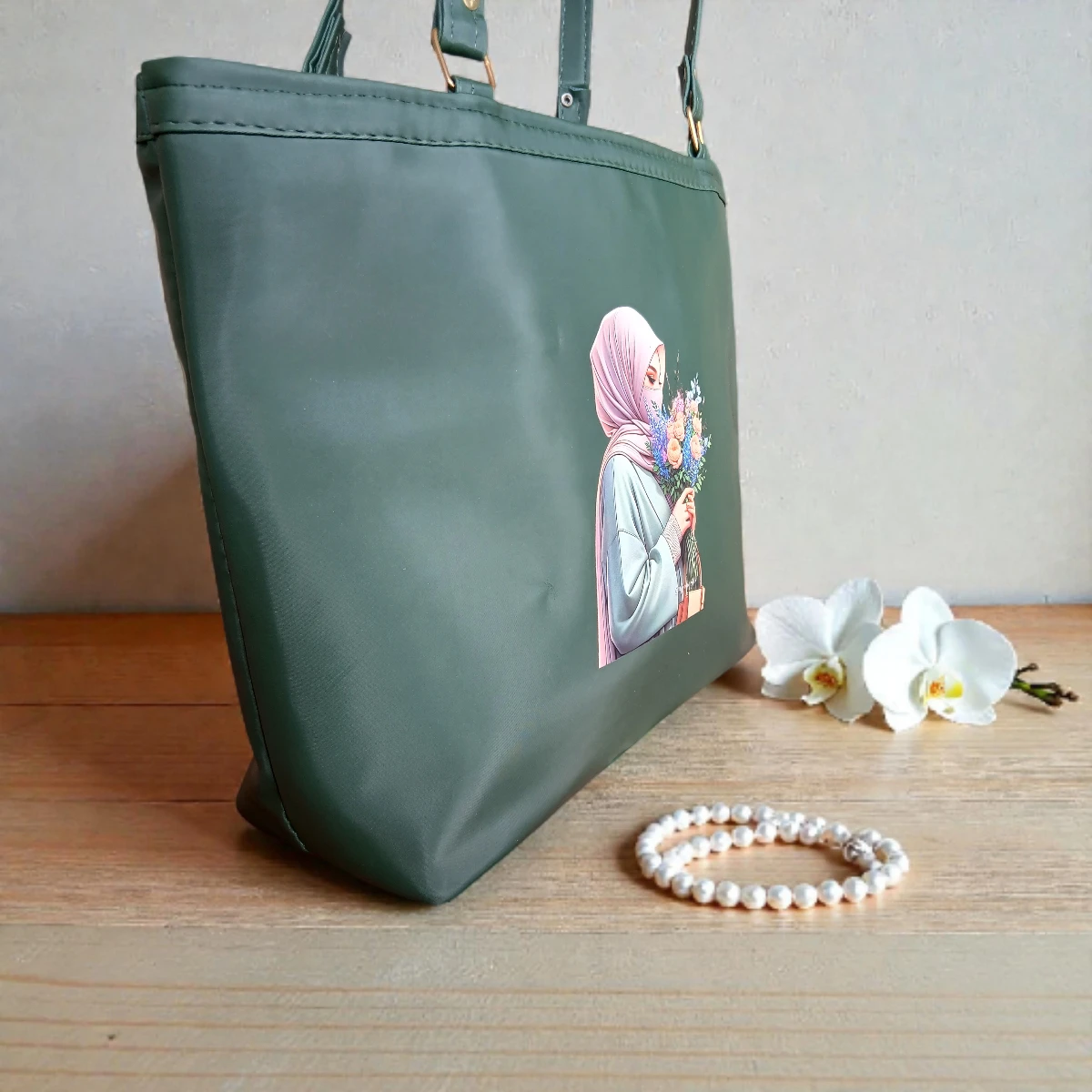 Side view of deep green printed ladies tote bag showing depth and leather finish