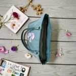 Top view of deep green ladies tote bag showing zip compartments and spacious interio