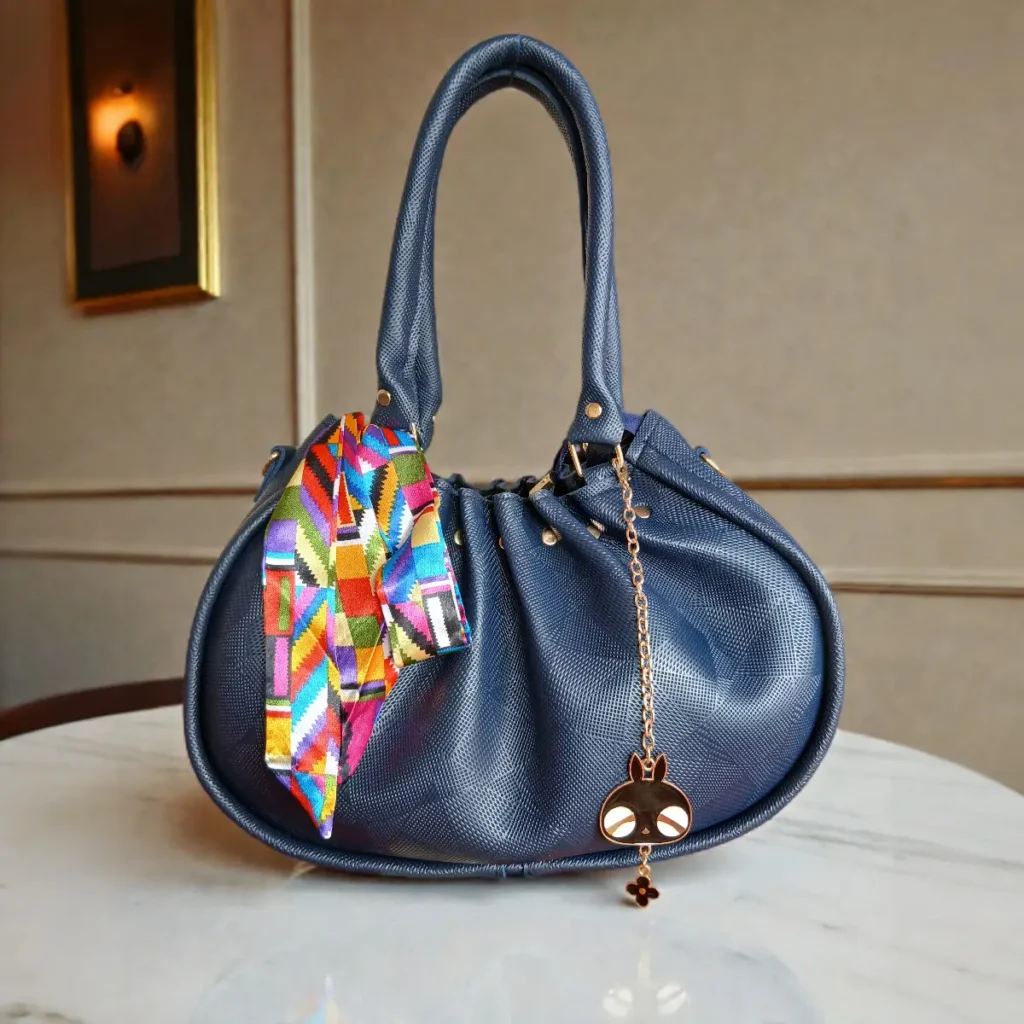 Navy blue soft drawstring handbag with scarf detail front view