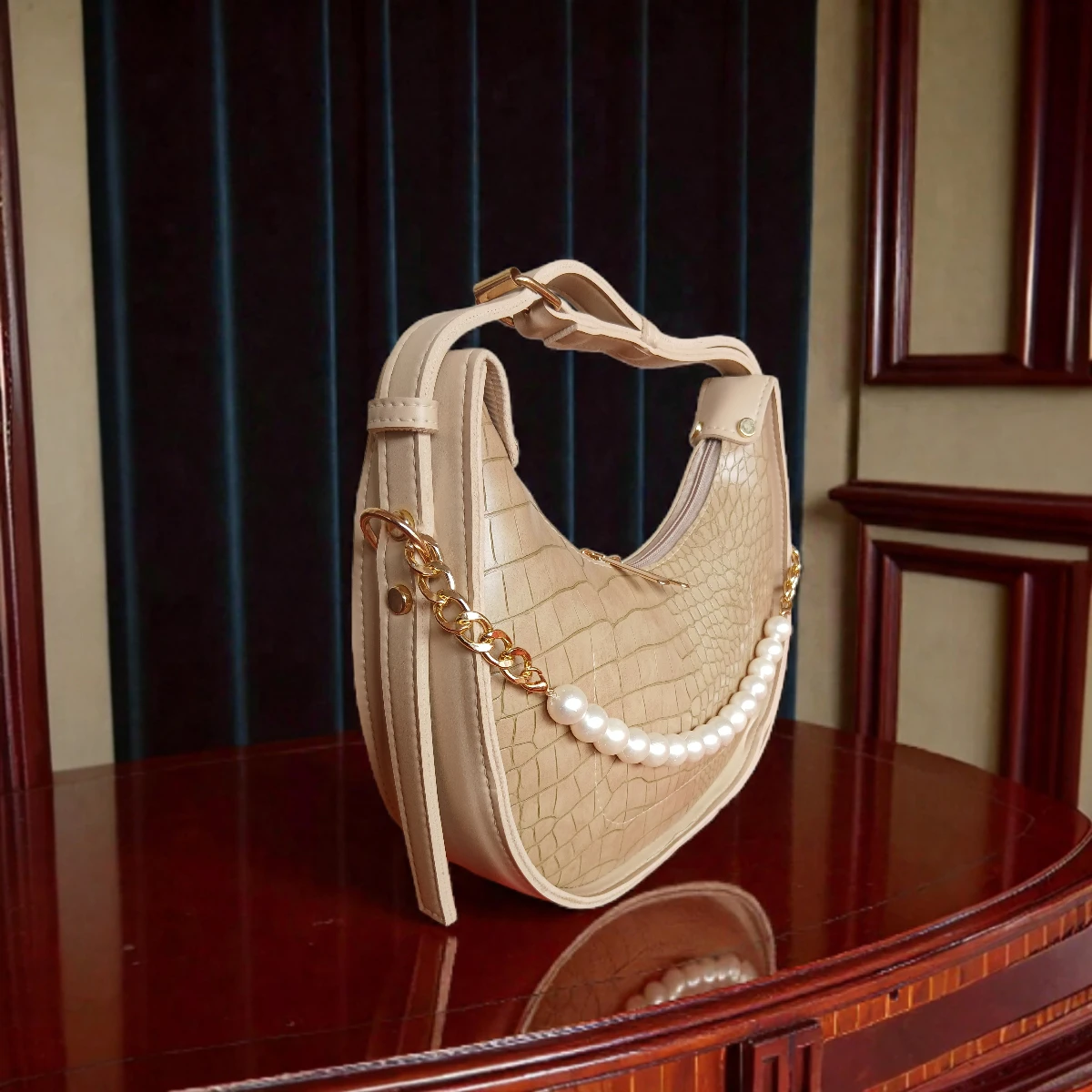 Beige textured crossbody bag side angle showing pearl detail