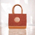 Brown tweed crossbody handbag with top handles front view