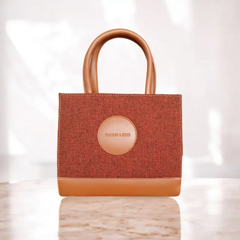 Brown tweed crossbody handbag with top handles front view