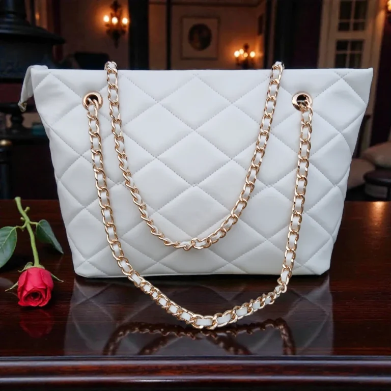 Classic Quilted Chain Strap Tote Bag Pearl White with diamond quilted pattern and gold chain shoulder straps displayed on wooden table with red rose decor