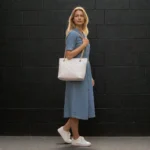 Model carrying Classic Quilted Chain Strap Tote Bag Pearl White on shoulder showing size and styling reference