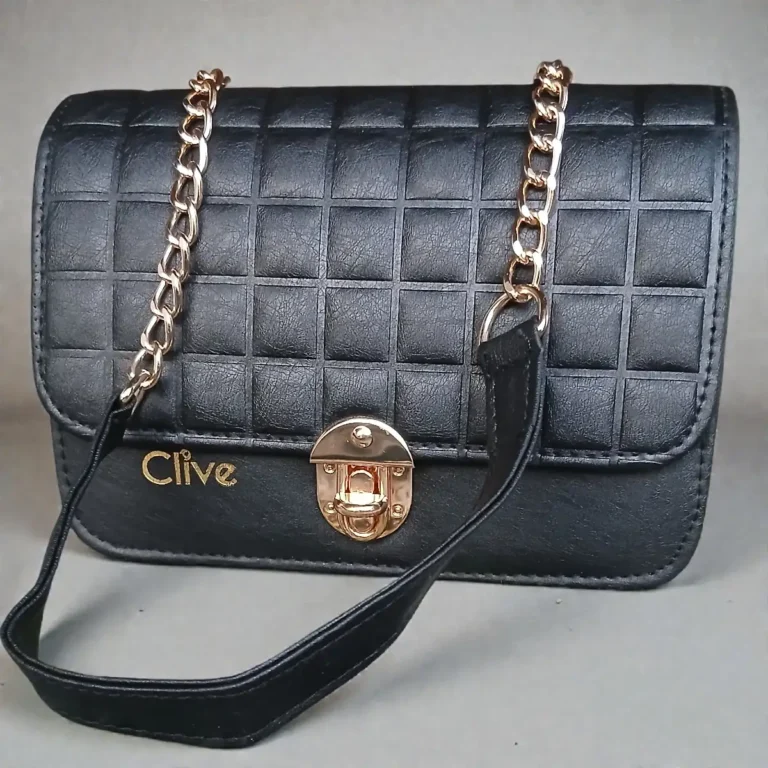 Front flap view of jet black grid embossed leather crossbody purse with gold lock and chain strap
