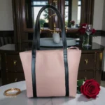 Minimal Contrast Strap Tote Handbag – Blush Pink front view with black straps on marble table